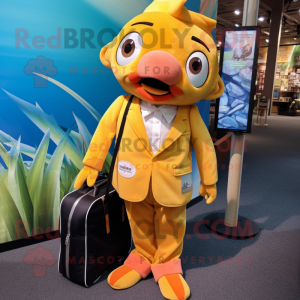 Gold Clown Fish mascot costume character dressed with a Suit Jacket and Tote bags