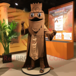 Brown King mascot costume character dressed with a Suit Pants and Shawl pins