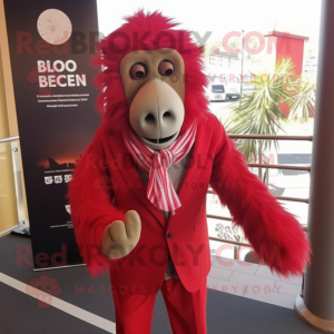 Red Baboon mascot costume character dressed with a Suit Pants and Scarves