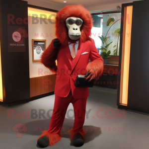 Red Baboon mascot costume character dressed with a Suit Pants and Scarves