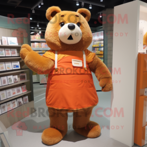 Orange Bear mascot costume character dressed with a A-Line Dress and Wallets