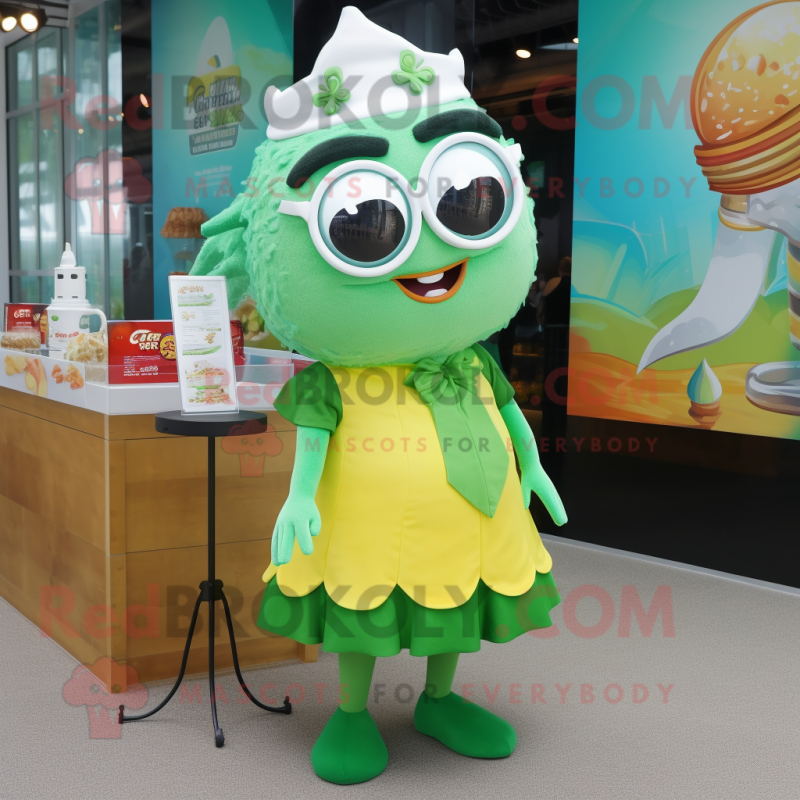 Green Fish And Chips mascot costume character dressed with a A-Line Skirt and Eyeglasses