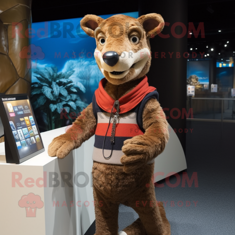 Brown Thylacosmilus mascot costume character dressed with a Cardigan and Keychains Brown Thylacosmilus mascot costume character dressed with a Cardigan and Keychains