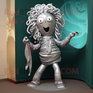 Silver Medusa mascot costume character dressed with a Suit Pants and Scarves