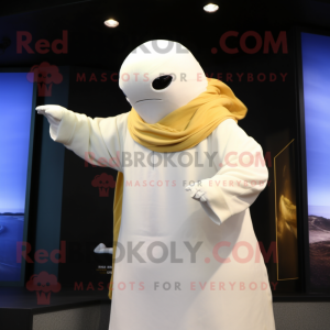 Gold Beluga Whale mascot costume character dressed with a Polo Tee and Shawl pins