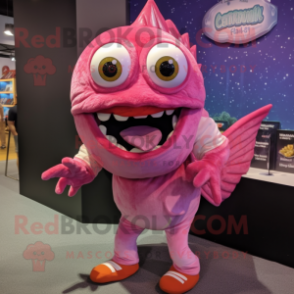 Pink Piranha mascot costume character dressed with a Graphic Tee and Rings