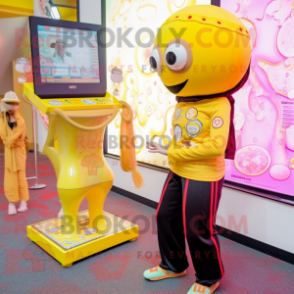 Yellow Gumball Machine mascot costume character dressed with a Yoga Pants and Headbands