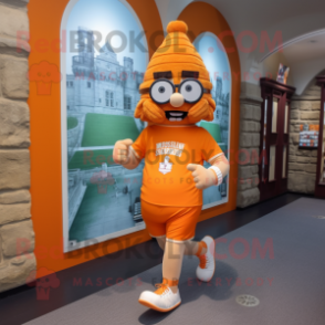 Orange Irish Castle mascot costume character dressed with a Running Shorts and Eyeglasses