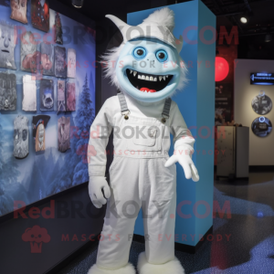 White Demon mascot costume character dressed with a Dungarees and Hat pins