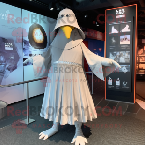 Silver Albatross mascot costume character dressed with a Empire Waist Dress and Beanies