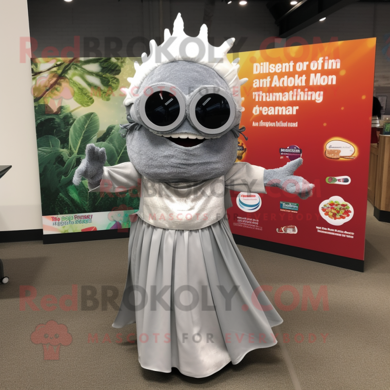 Silver Tacos mascot costume character dressed with a Maxi Dress and Reading glasses Silver Tacos mascot costume character dressed with a Maxi Dress and Reading glasses