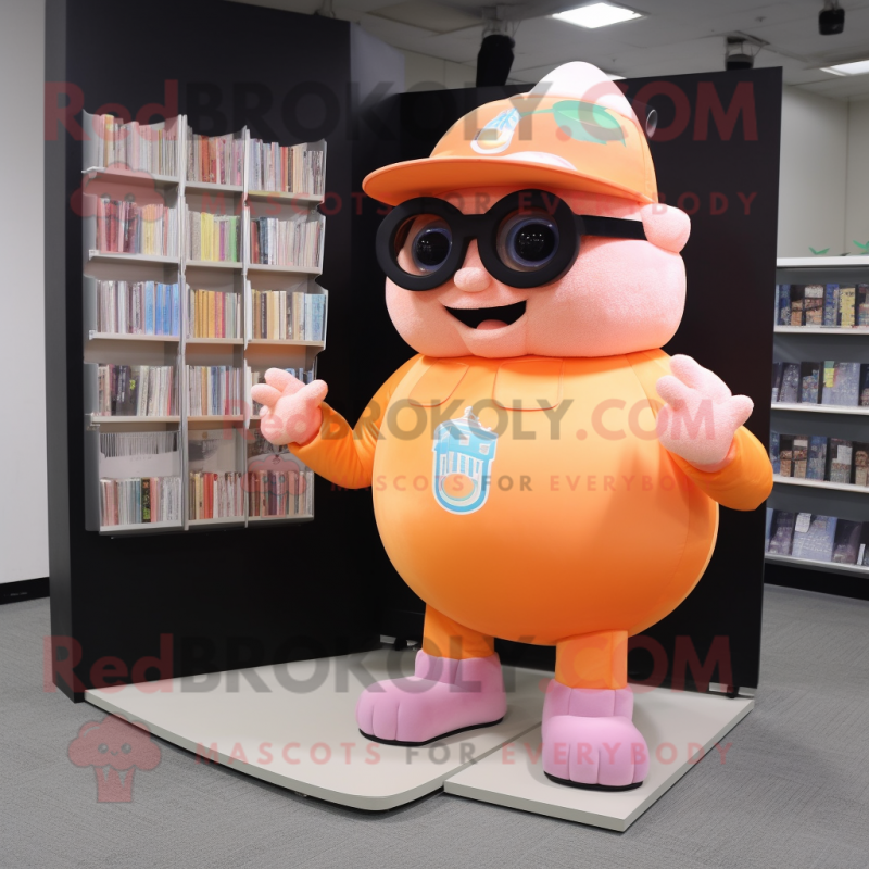 Peach Strongman mascot costume character dressed with a Cover-up and Reading glasses Peach Strongman mascot costume character dressed with a Cover-up and Reading glasses