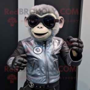 Silver Monkey mascot costume character dressed with a Biker Jacket and Smartwatches