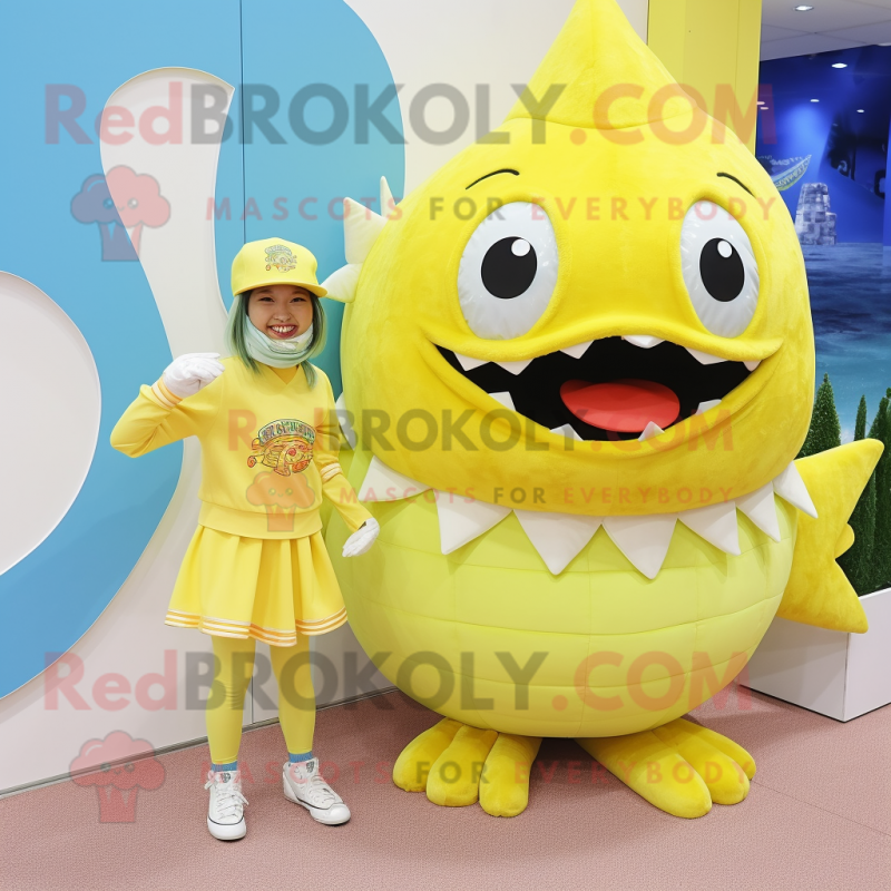 Lemon Yellow Piranha mascot costume character dressed with a Mini Dress and Beanies