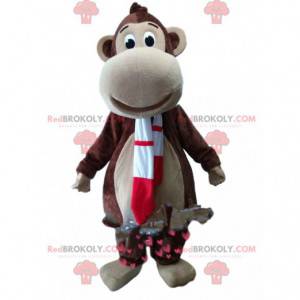 Brun abe-maskot med et rødt og hvidt tørklæde - Redbrokoly.com