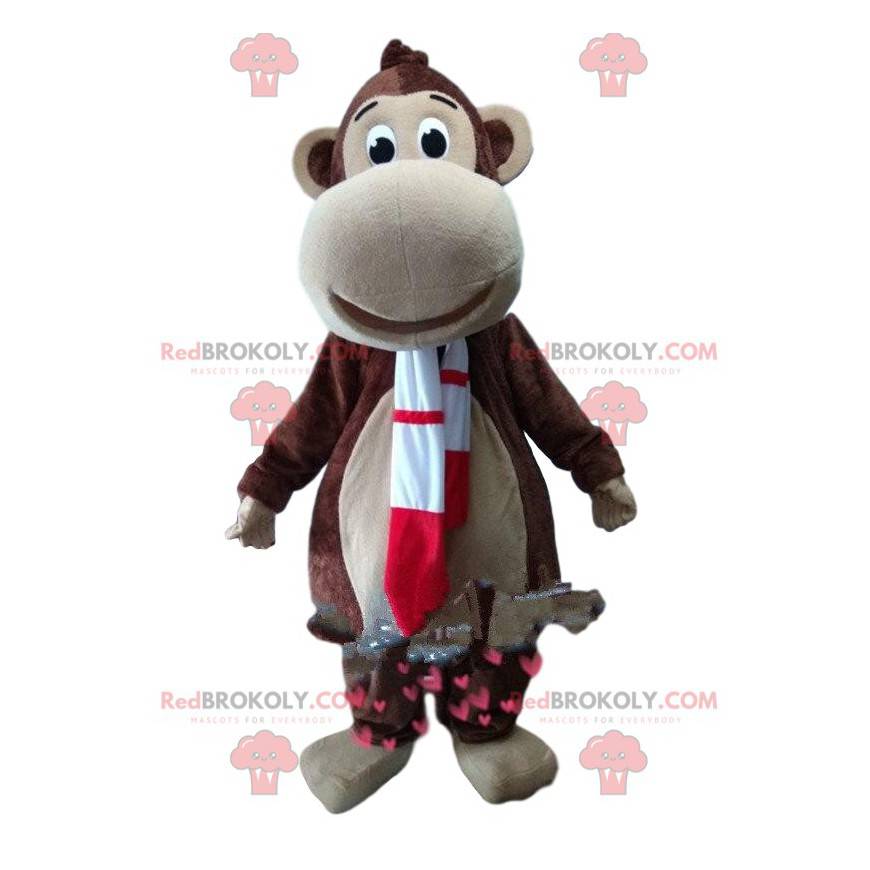 Mascotte scimmia marrone con una sciarpa rossa e bianca -
