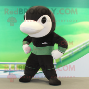 Olive Killer Whale mascot costume character dressed with a Swimwear and Shoe laces