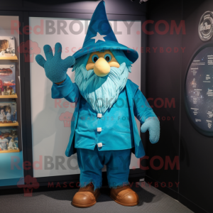 Turquoise Wizard mascot costume character dressed with a Dungarees and Gloves