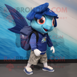 Navy Betta Fish mascot costume character dressed with a Polo Shirt and Backpacks