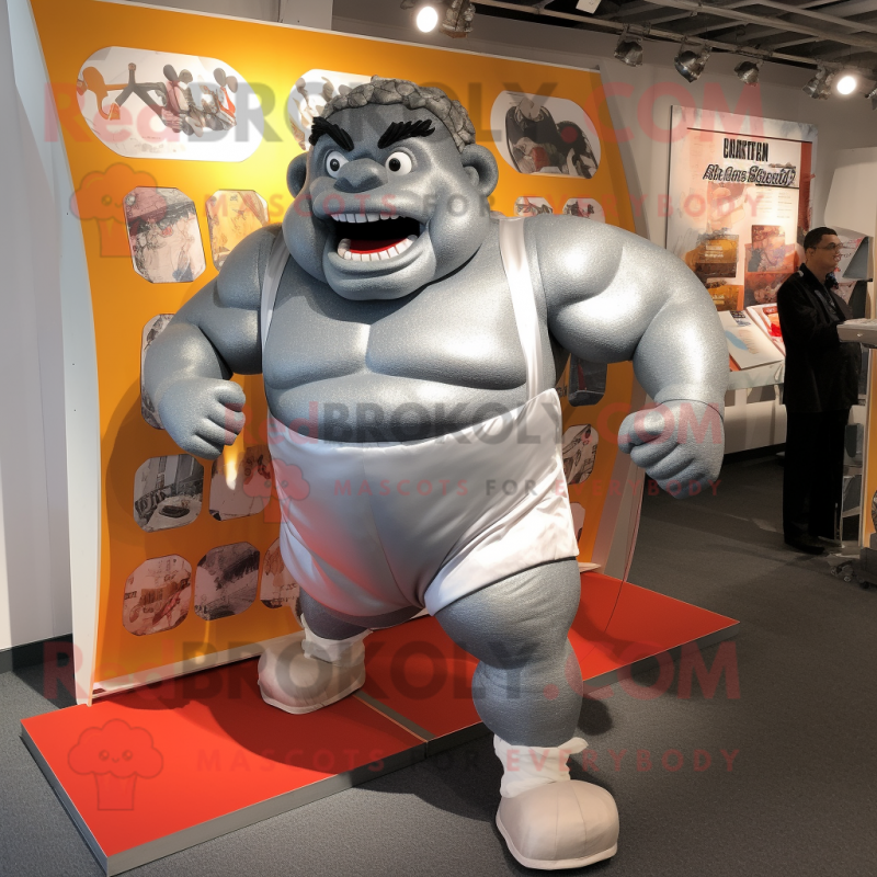 Silver Strongman mascot costume character dressed with a Running Shorts and Wraps