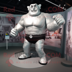 Silver Strongman mascot costume character dressed with a Running Shorts and Wraps