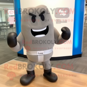 Gray Boxing Glove mascot costume character dressed with a Dress Pants and Bow ties