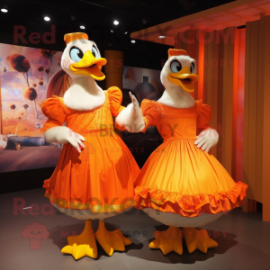 Orange Geese mascot costume character dressed with a Ball Gown and Hats