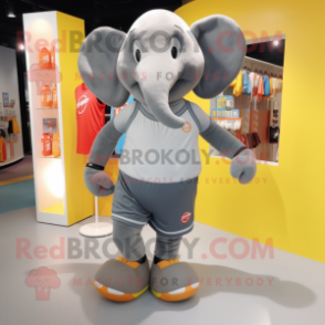 Gray Elephant mascot costume character dressed with a Running Shorts and Coin purses