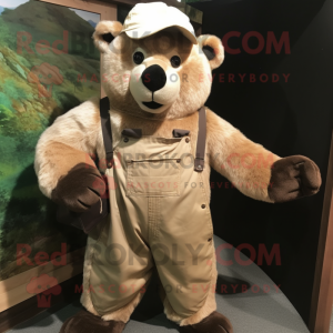 Beige Spectacled Bear mascot costume character dressed with a Dungarees and Hat pins