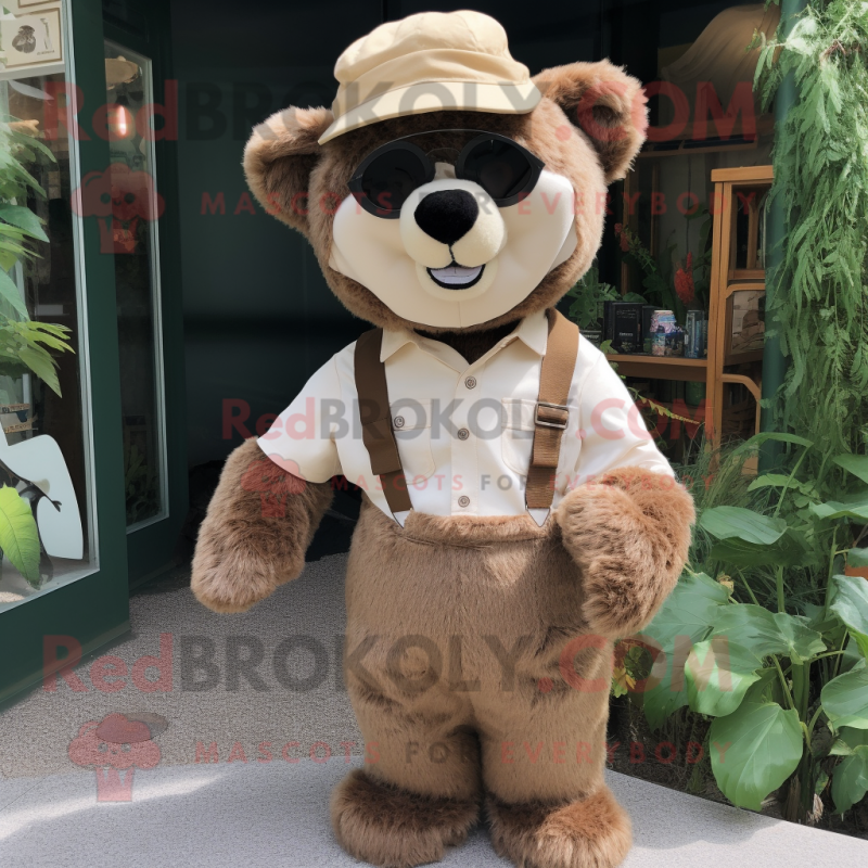 Beige Spectacled Bear mascot costume character dressed with a Dungarees and Hat pins Beige Spectacled Bear mascot costume character dressed with a Dungarees and Hat pins