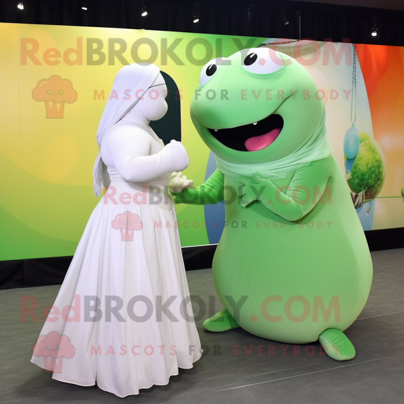 Olive Beluga Whale mascot costume character dressed with a Ball Gown and Ties