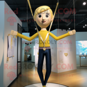 Gold Trapeze Artist mascot costume character dressed with a Yoga Pants and Tie pins