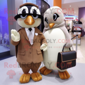 Tan Penguin mascot costume character dressed with a Blouse and Clutch bags