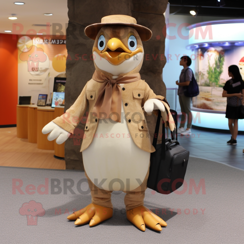 Tan Penguin mascot costume character dressed with a Blouse and Clutch bags