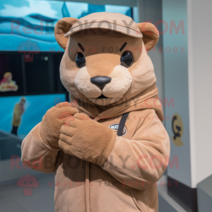 Beige Jaguarundi mascot costume character dressed with a Hoodie and Berets