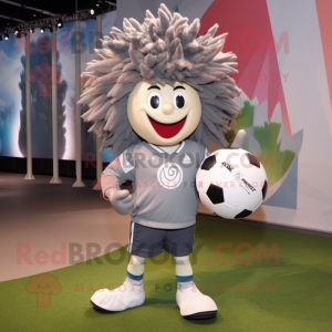 Gray Rugby Ball mascot costume character dressed with a Windbreaker and Hairpins