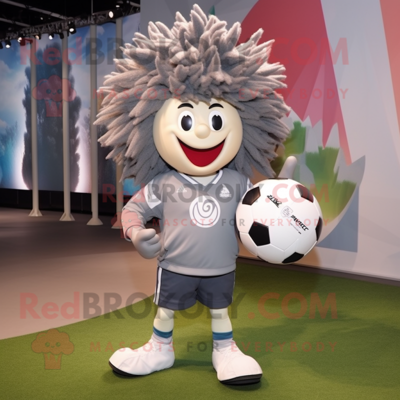 Gray Rugby Ball mascot costume character dressed with a Windbreaker and Hairpins Gray Rugby Ball mascot costume character dressed with a Windbreaker and Hairpins