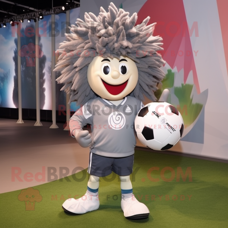 Gray Rugby Ball mascot costume character dressed with a Windbreaker and Hairpins