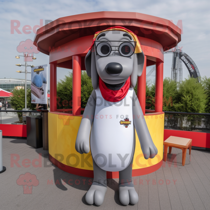 Gray Hot Dogs mascot costume character dressed with a T-Shirt and Eyeglasses Gray Hot Dogs mascot costume character dressed with a T-Shirt and Eyeglasses