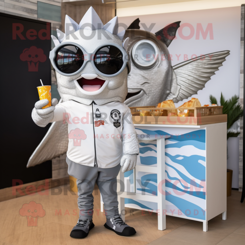 Silver Fish And Chips mascot costume character dressed with a Graphic Tee and Sunglasses