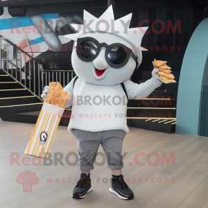 Silver Fish And Chips mascot costume character dressed with a Graphic Tee and Sunglasses