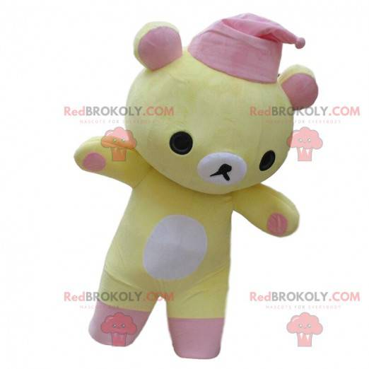 Yellow and white teddy bear mascot with a pink nightcap -