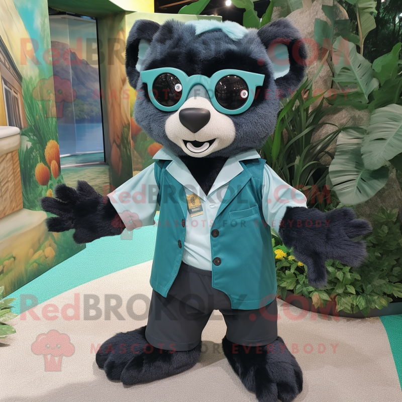 Teal Spectacled Bear mascot costume character dressed with a Romper and Pocket squares Teal Spectacled Bear mascot costume character dressed with a Romper and Pocket squares