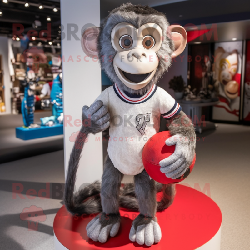 Silver Monkey mascot costume character dressed with a Rugby Shirt and Tote bags