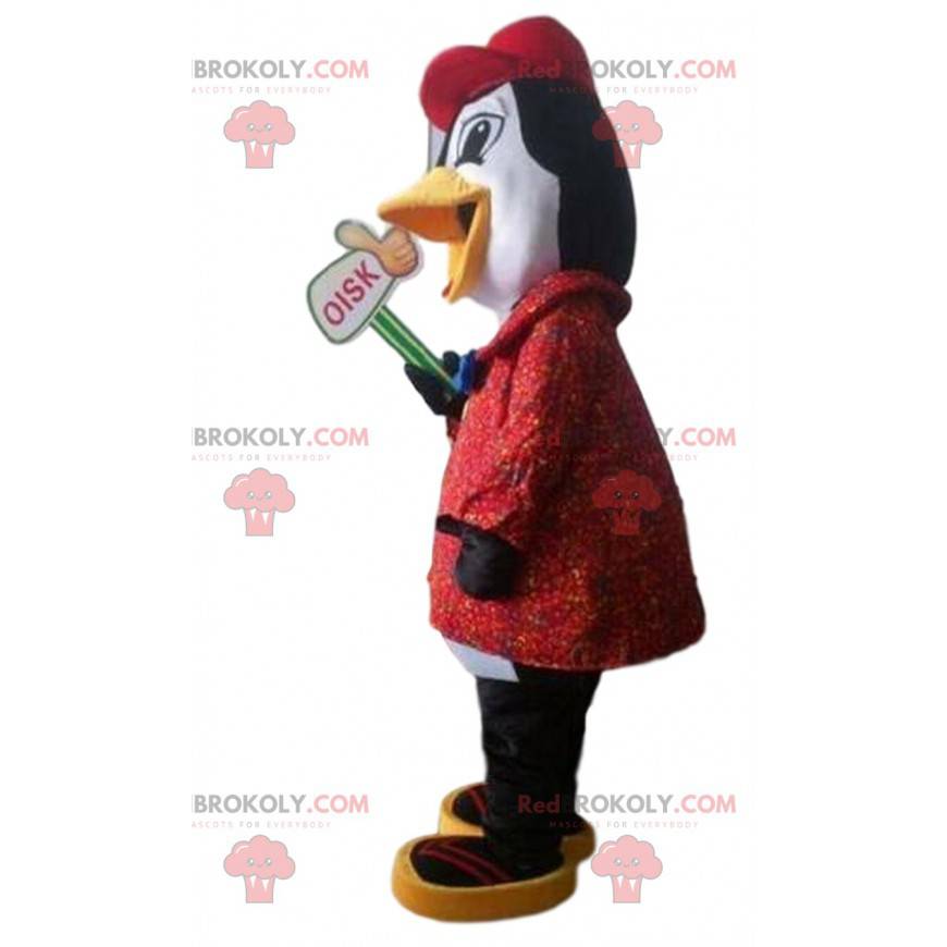 Mascote pinguim preto e branco com casaco vermelho -