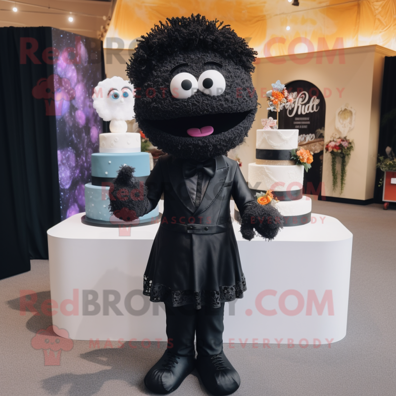 Black Wedding Cake mascot costume character dressed with a Jeggings and Lapel pins Black Wedding Cake mascot costume character dressed with a Jeggings and Lapel pins