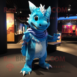 Sky Blue Dragon mascot costume character dressed with a Playsuit and Shawl pins