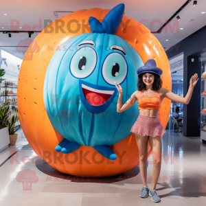 Blue Grapefruit mascot costume character dressed with a One-Piece Swimsuit and Rings