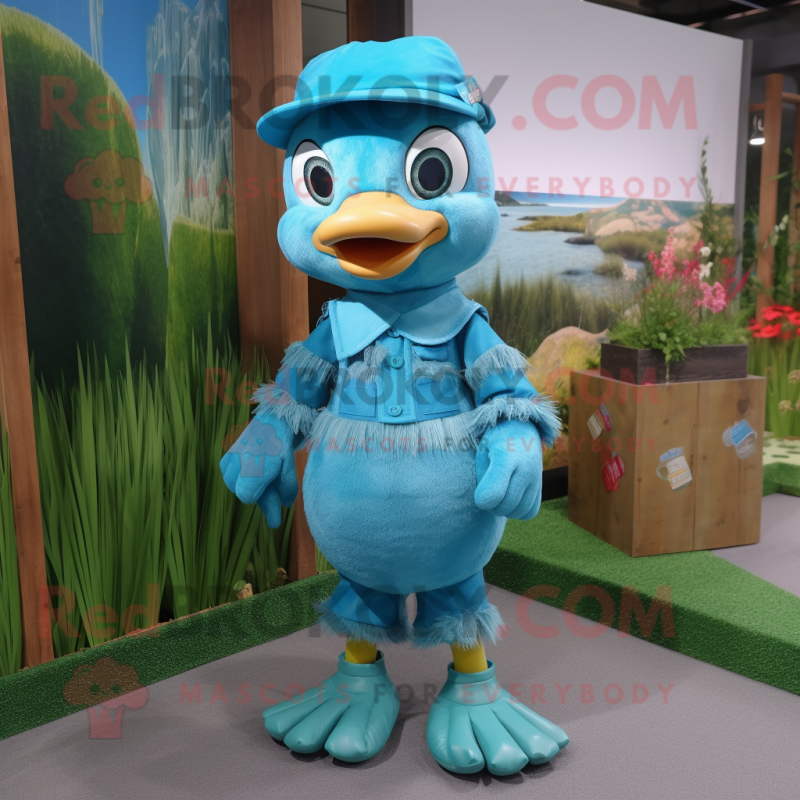 Turquoise Gosling mascot costume character dressed with a Dungarees and Caps