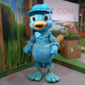 Turquoise Gosling mascot costume character dressed with a Dungarees and Caps